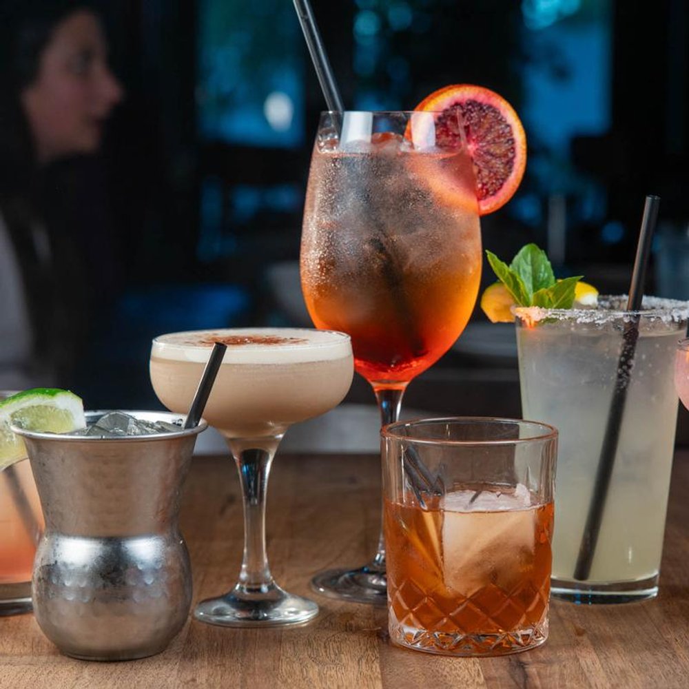 Assorted Cocktails On A Counter.