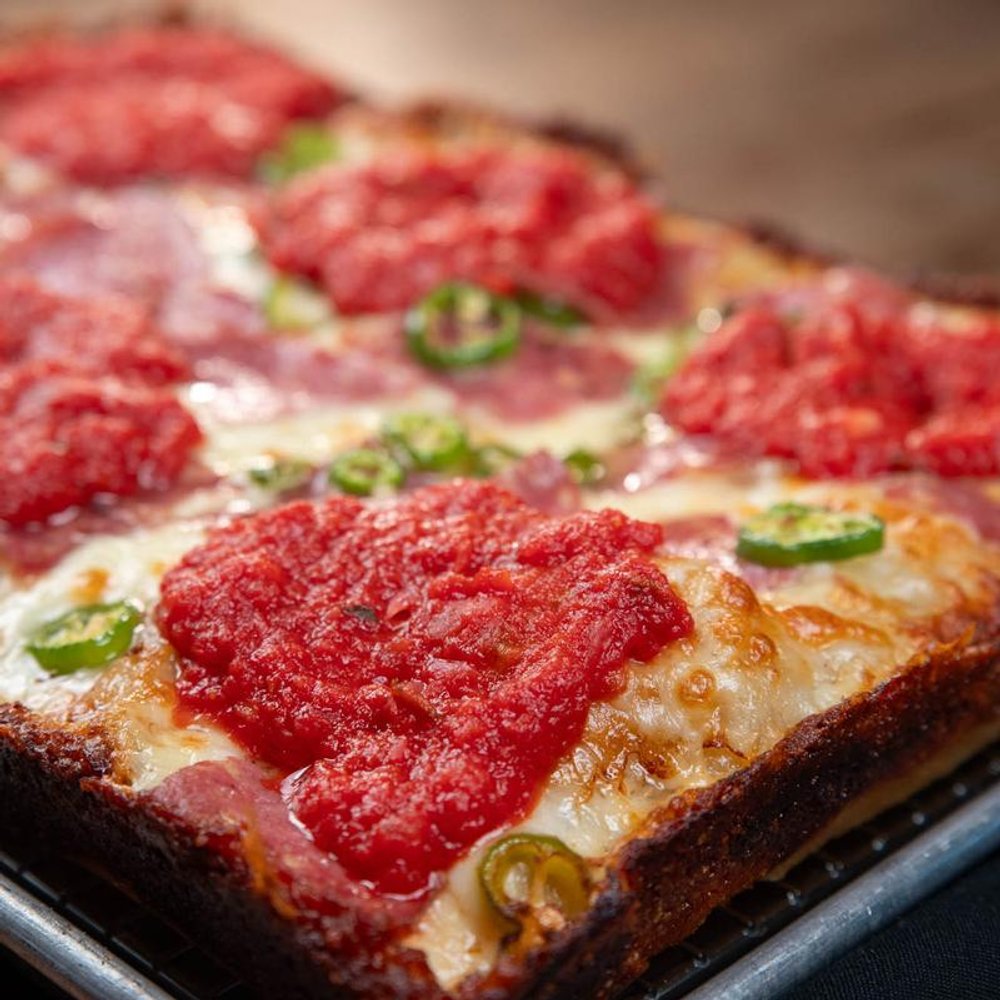 Close Up Of A Square Soppressata Pizza With Tomato Basil Sauce And Serrano Peppers.