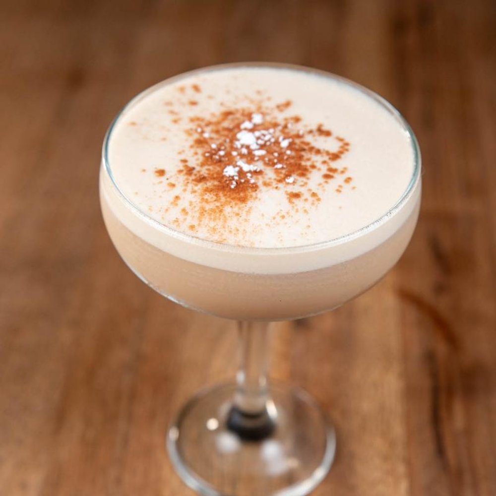 Espresso Martini Cocktail Sprinkled With Cinnamon.