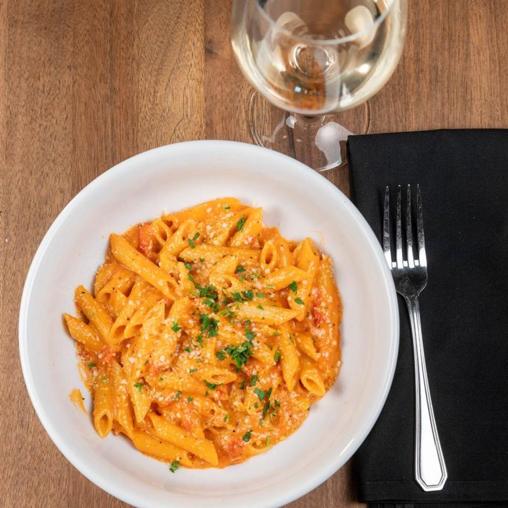 Penne Vodka Pasta With A Glass Of Wine.