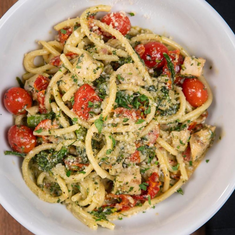 Spicy Fettuccini Pasta With Peperoni Salami Tomatoes And Serrano Peppers.
