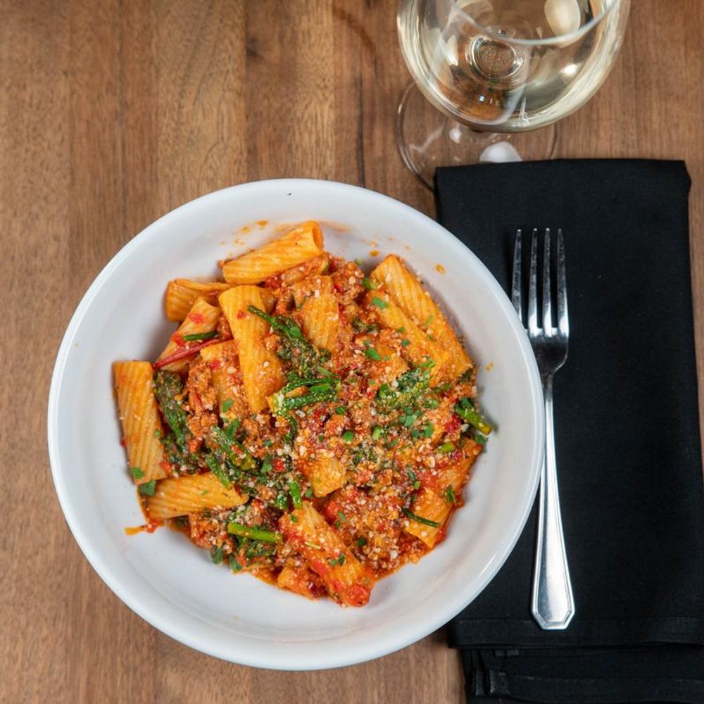 Spicy Rigatoni With A Glass Of White Wine.