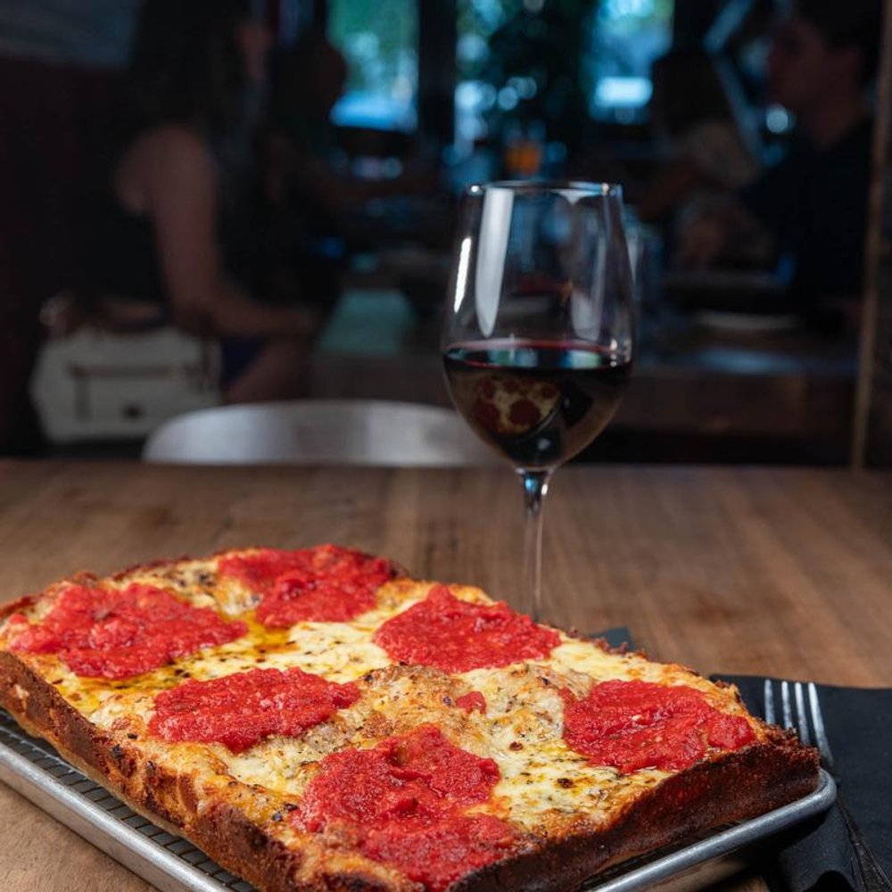 Square Cheese Pizza With Tomato Basil Sauce And Oregano Served With Red Wine.