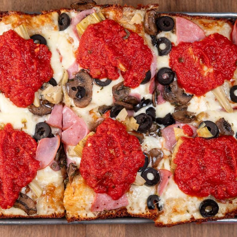Square Pizza With Cheese Basil Tomato Sauce Mushrooms Ham And Olives.