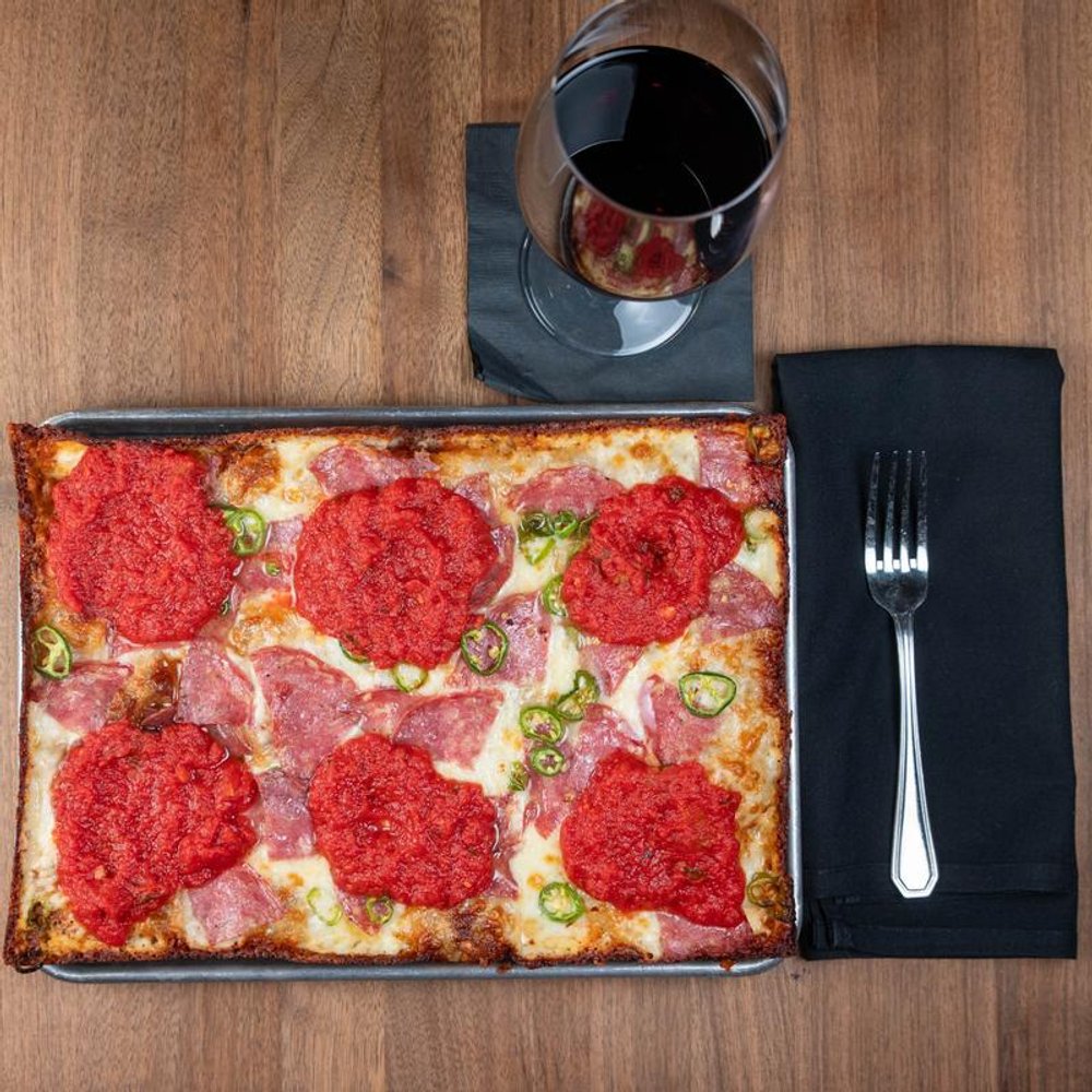 Square Soppresata Pizza With Serrano Peppers And Basil Tomato Sauce Served With Red Wine.