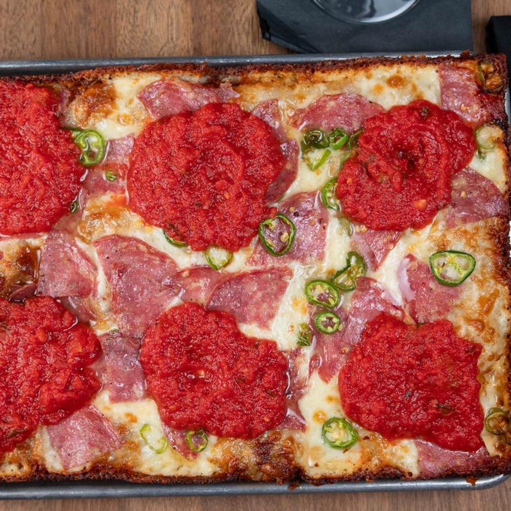 Square Soppresata Pizza With Serrano Peppers Basil Tomato Sauce And Honey.